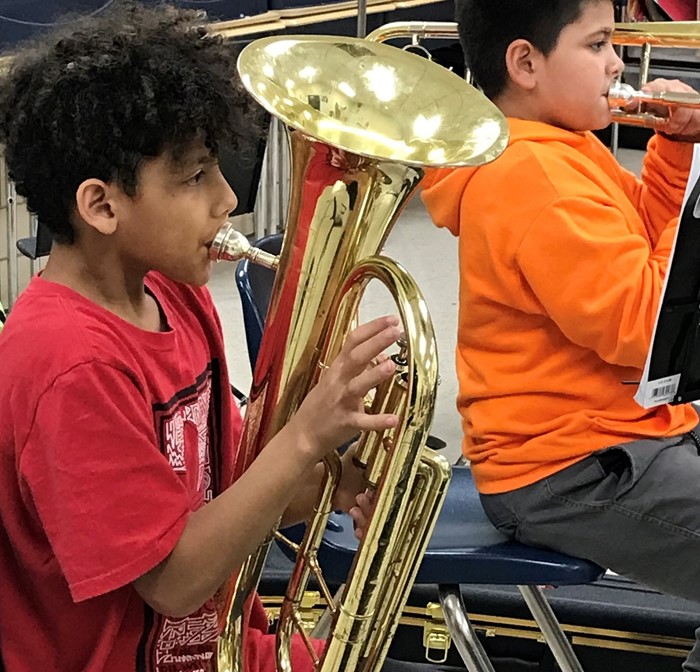 Students playing in band class